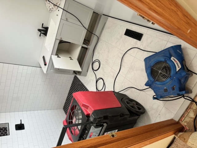 Bathroom water damage restoration equipment setup Minneapolis Minnesota