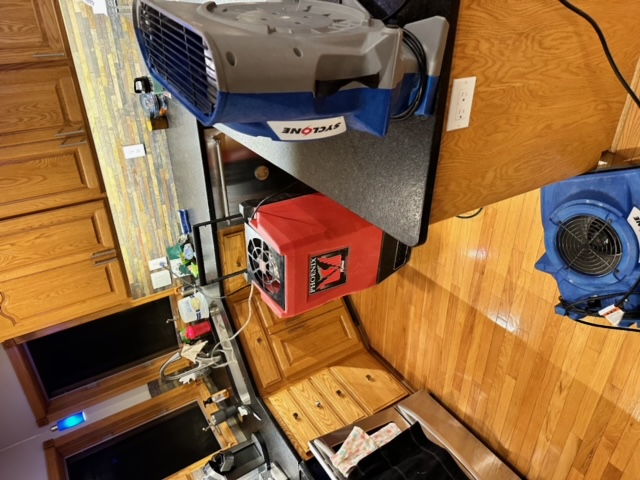 Kitchen hardwood floor water damage drying equipment Minneapolis